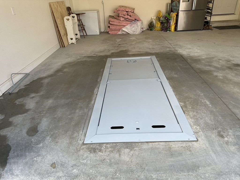 Completed in-ground garage tornado shelter installation in Tennessee